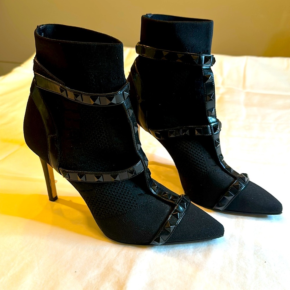 Black sock booties with leather straps and studs